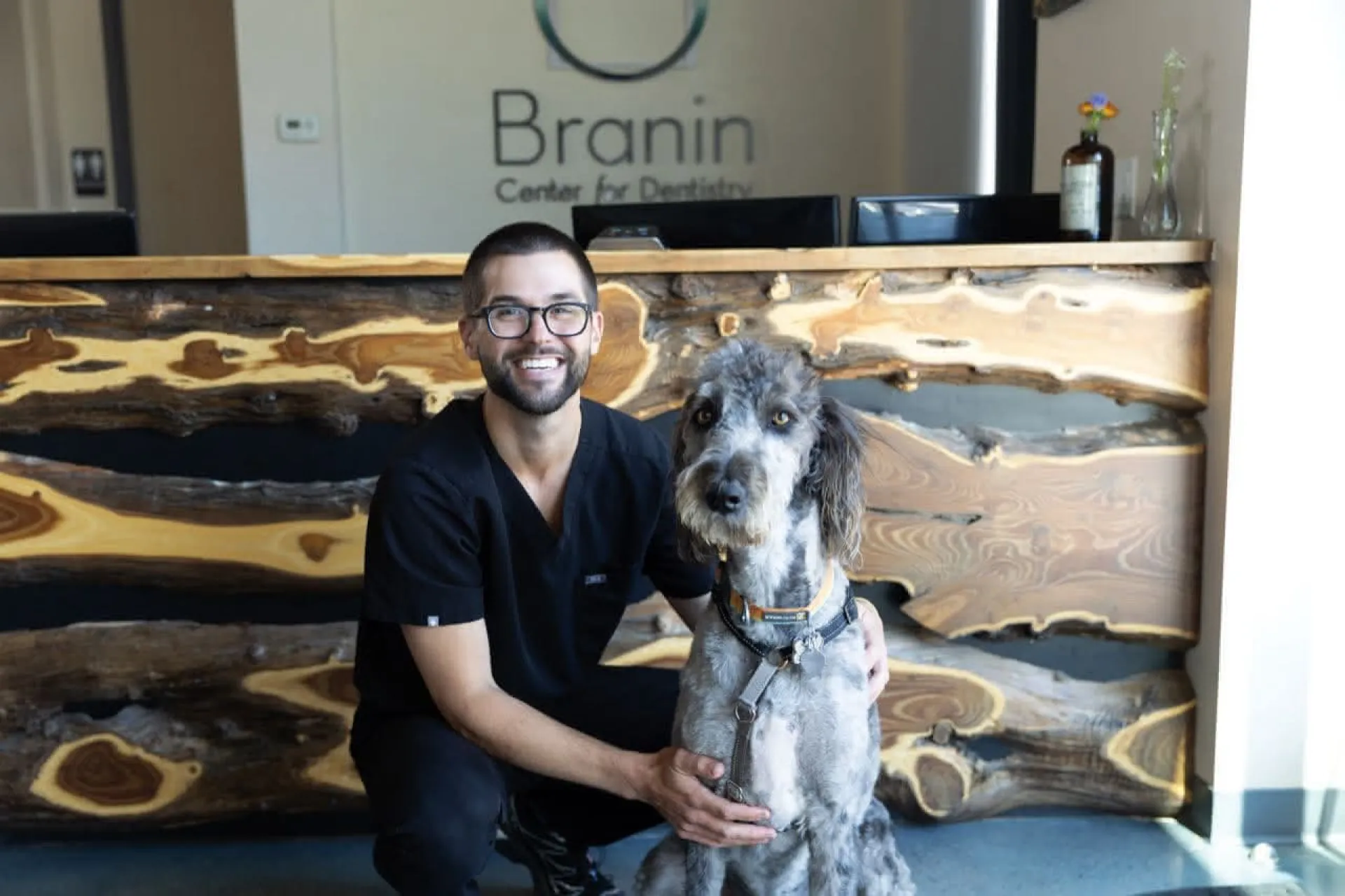 Adam with dog in the lobby