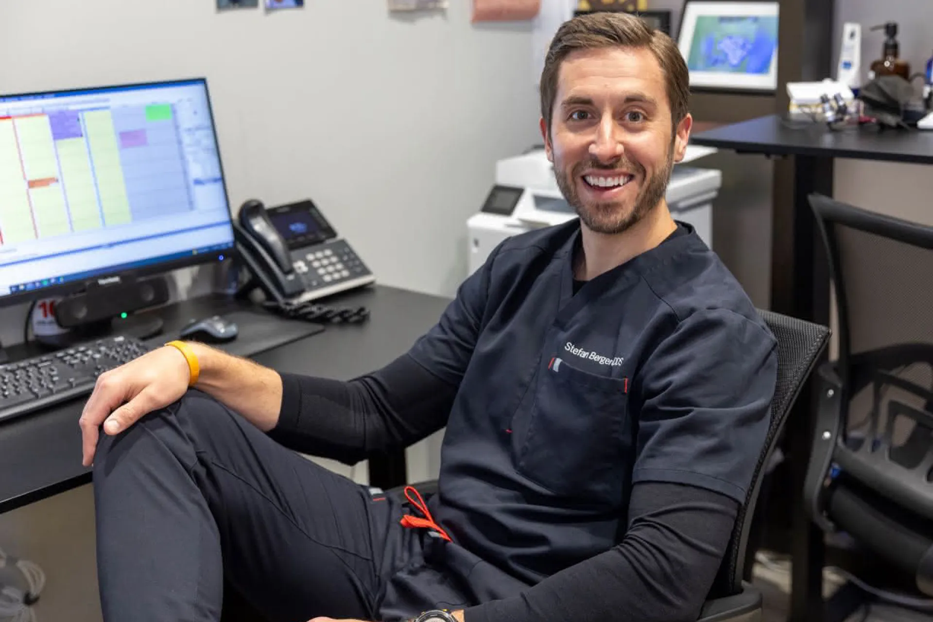 Dr. Berghoff sitting in a chair smiling