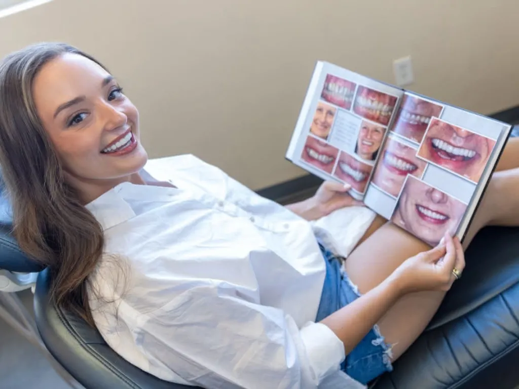 Patient looking at a smile gallery book