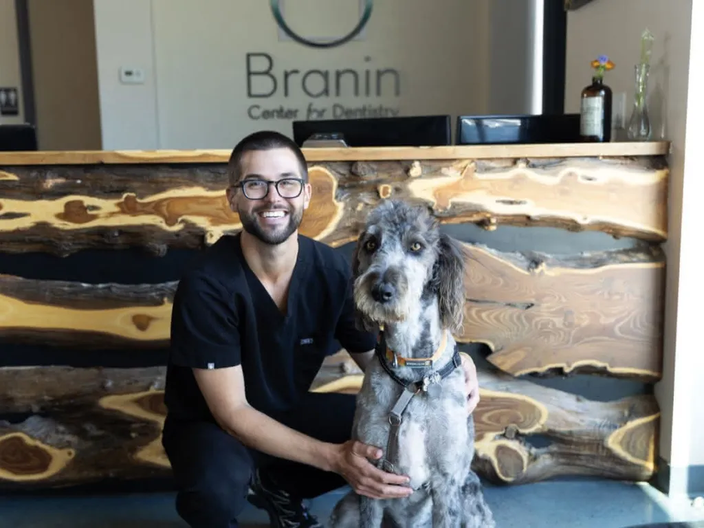 Adam with dog in the lobby