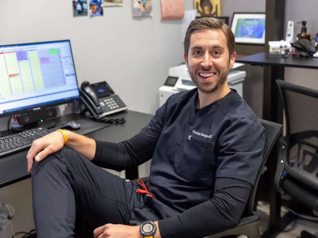 Dr. Berghoff sitting in a chair smiling