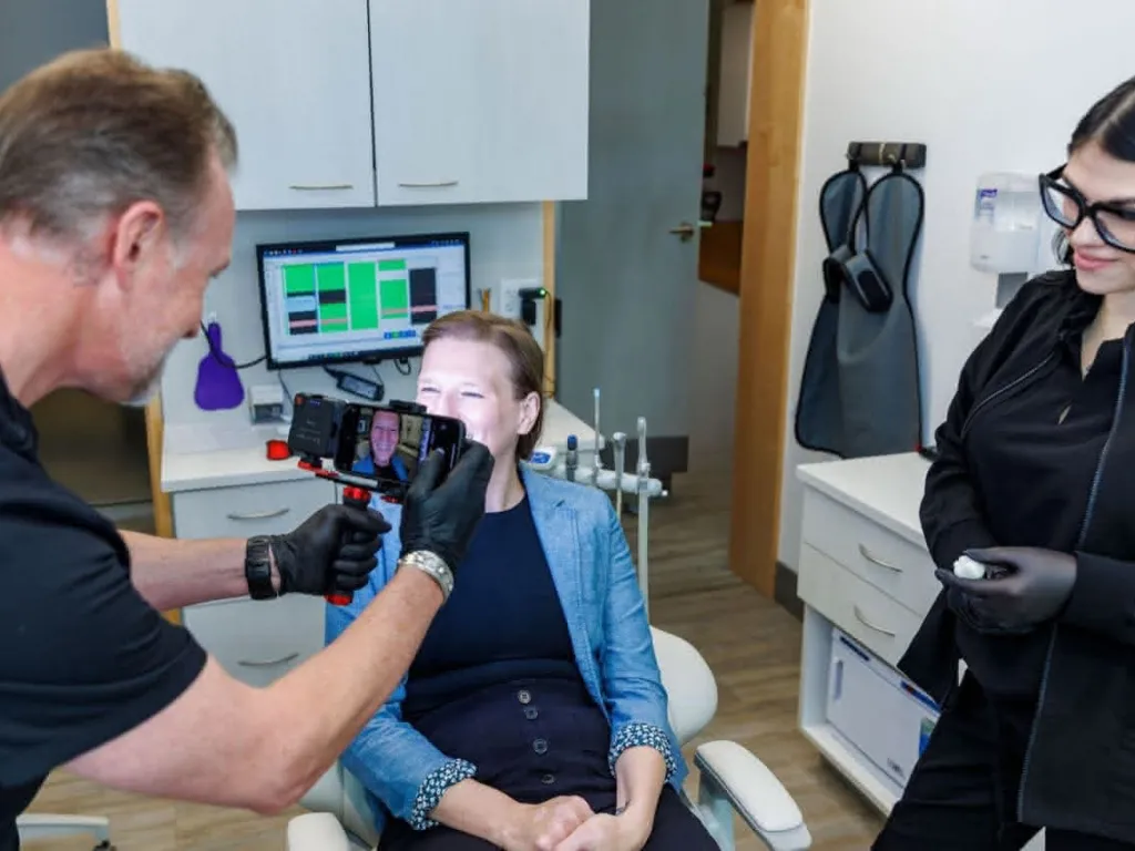 Dr. Bender and staff taking a photo of a smile