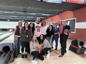 The team at Golden posing on a bowling lane