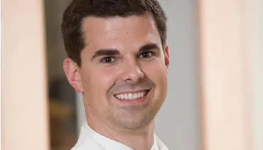 Dr Rob Cheron in a white coat